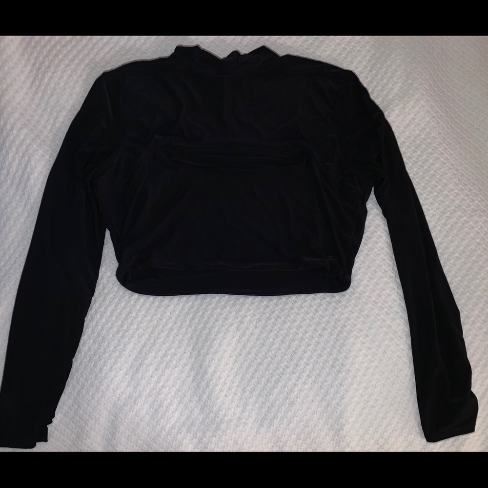 Black long sleeve top, spandex material, with slit